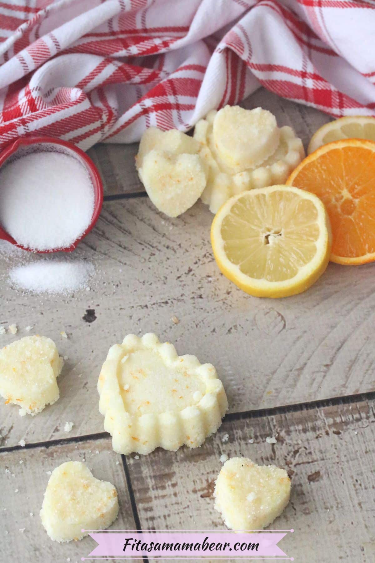 Pinterest image with text: heart-shaped sugar scrubs with sugar and lemon behind them