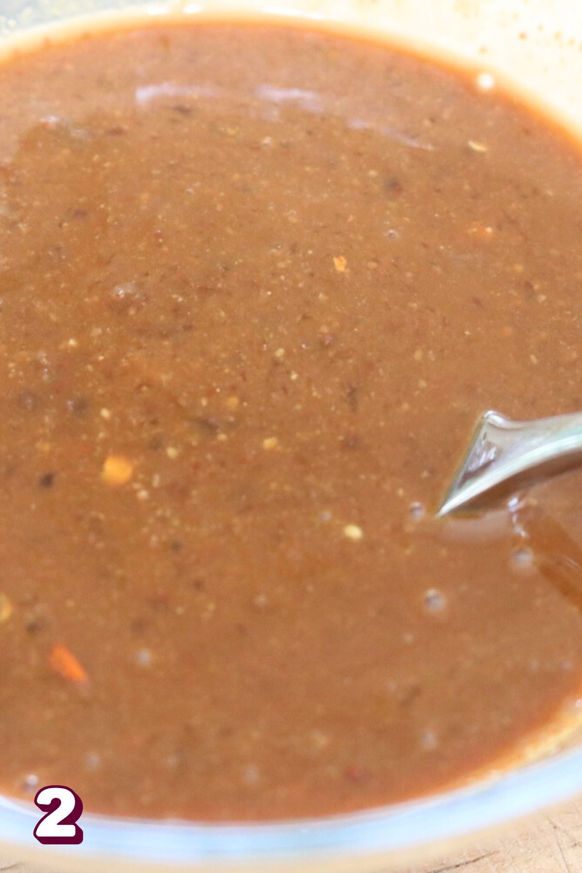 Miso lemon sauce in a bowl with a fork.