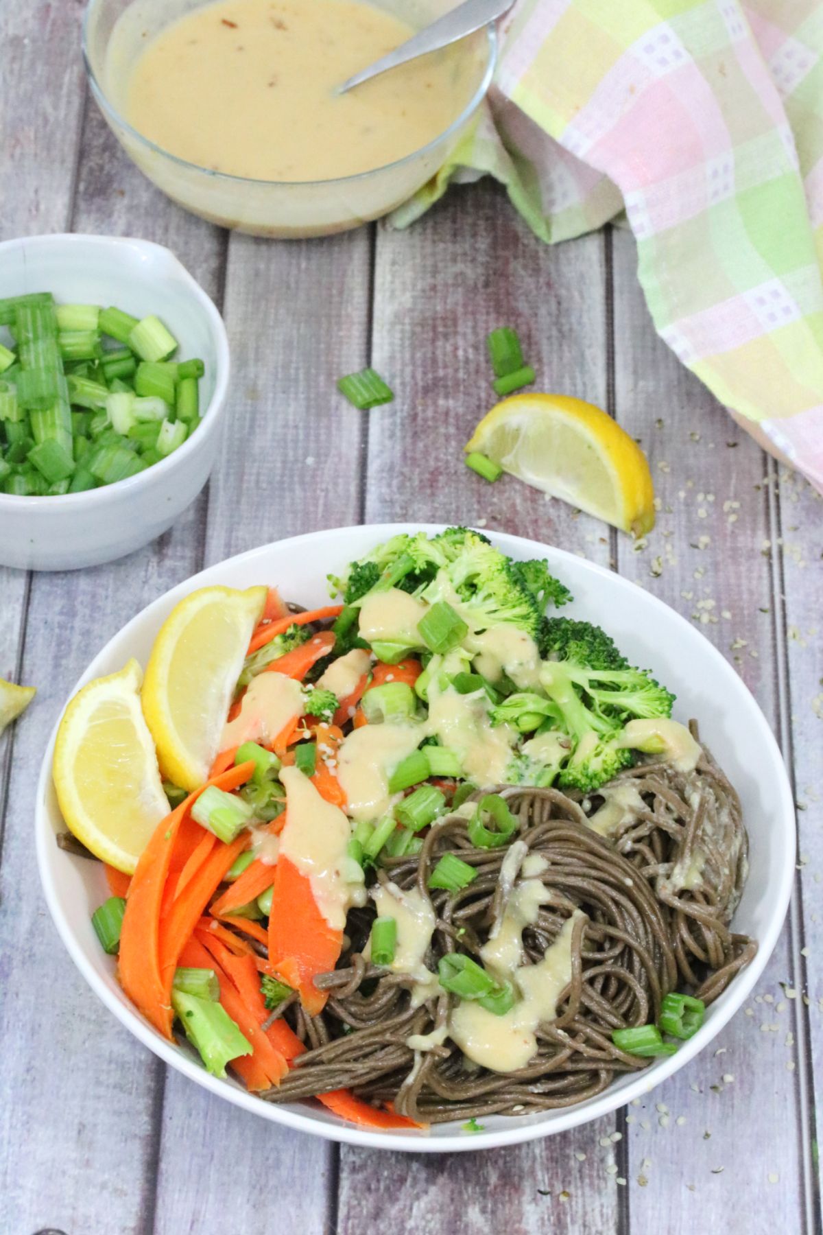 Soba noodles with broccoli and carrots drizzled with a lemon dressing.