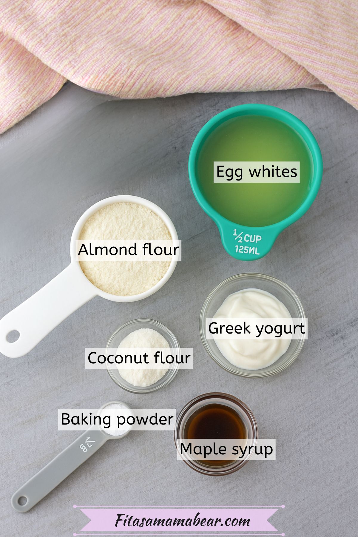 Multiple ingredients to make Greek yogurt panckaes like flours and yogurt in measuring cups with text over top.