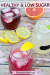 Pin image with text: three mason jars with colorful, healthy mocktails with sliced fruit around them
