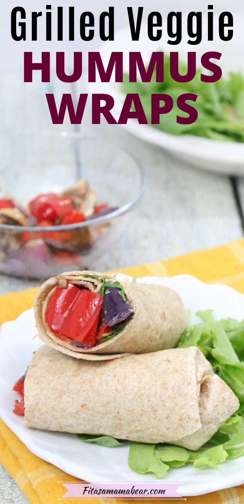 Hummus wrap cut in half on a plate with text above it.