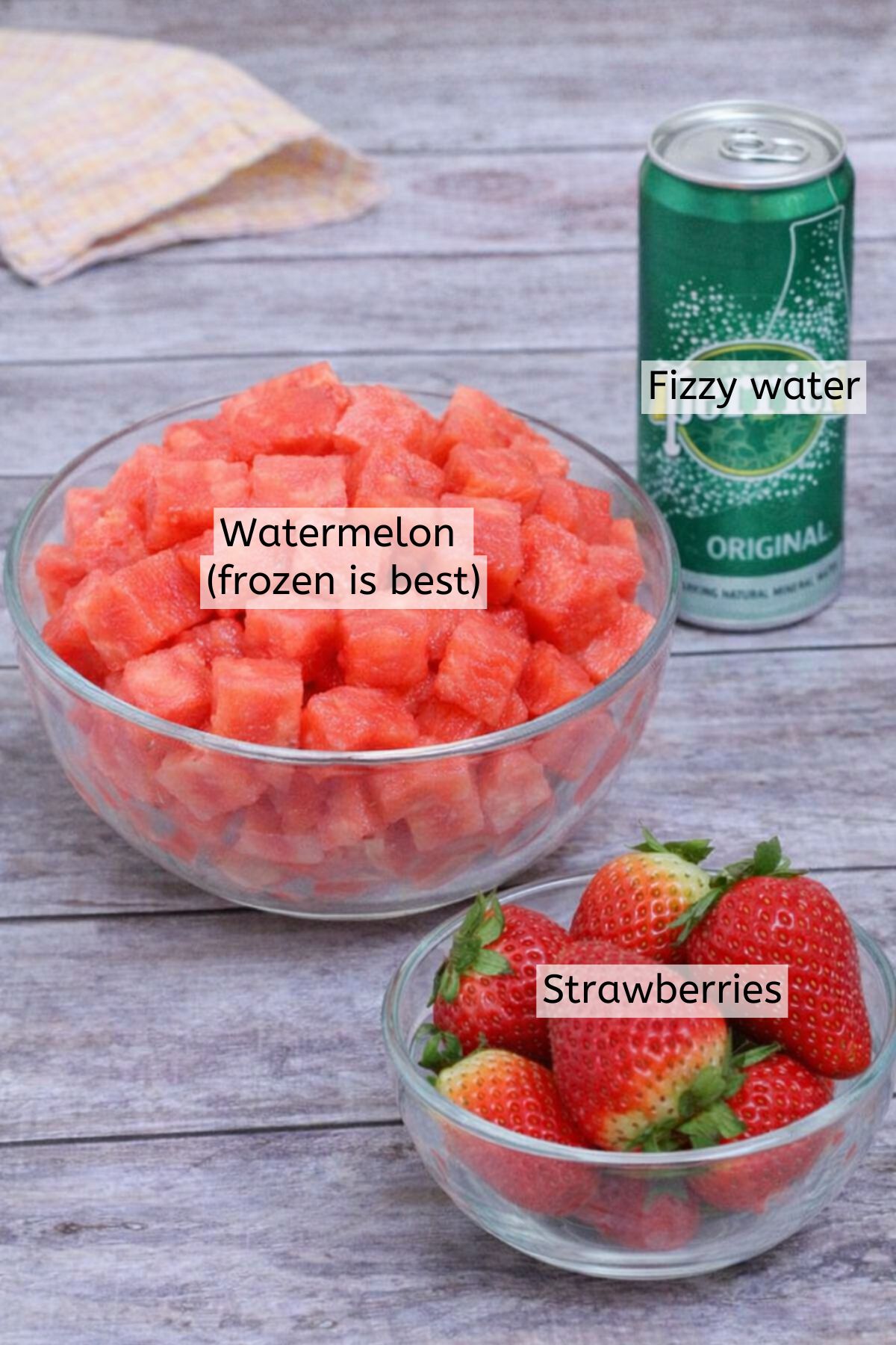 Watermelon and strawberries in bowls with a can of Perrier behind them and text labels over everything.