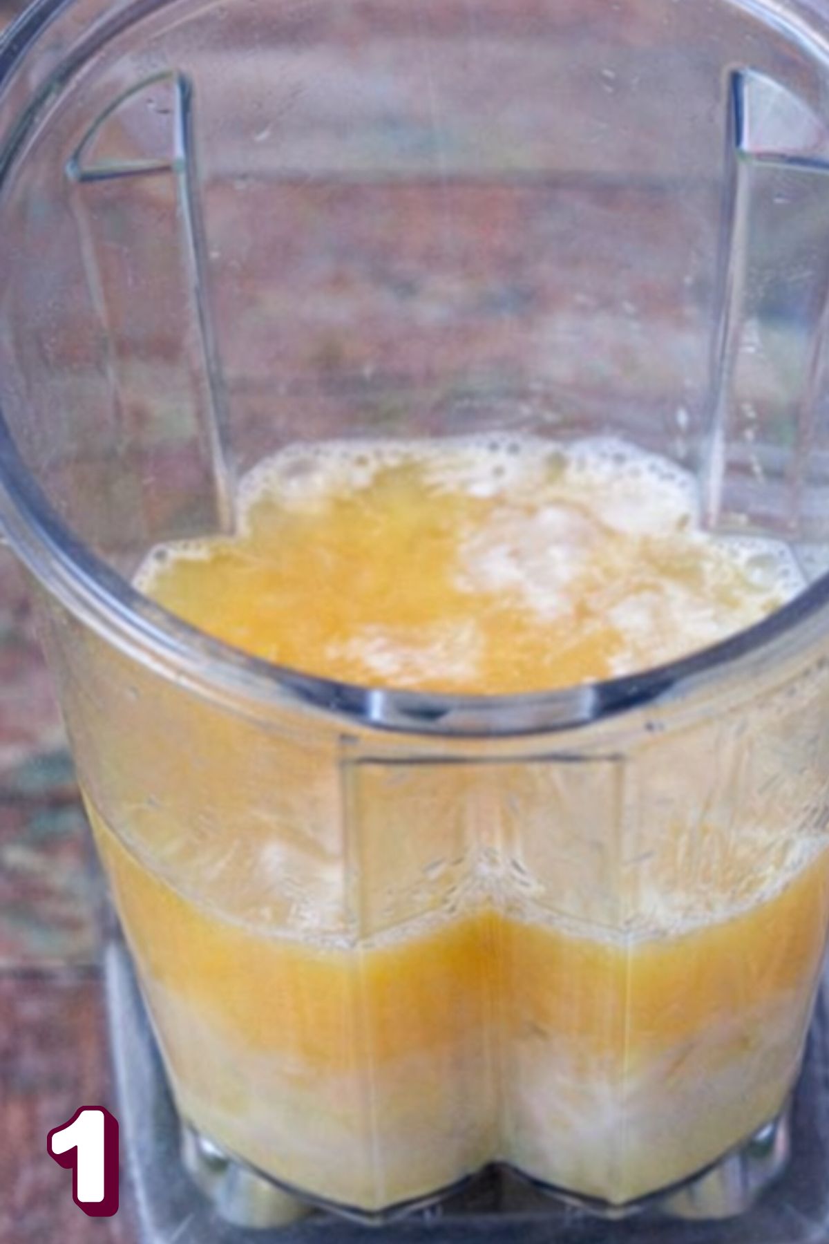 Orange juice and milk in a blender.