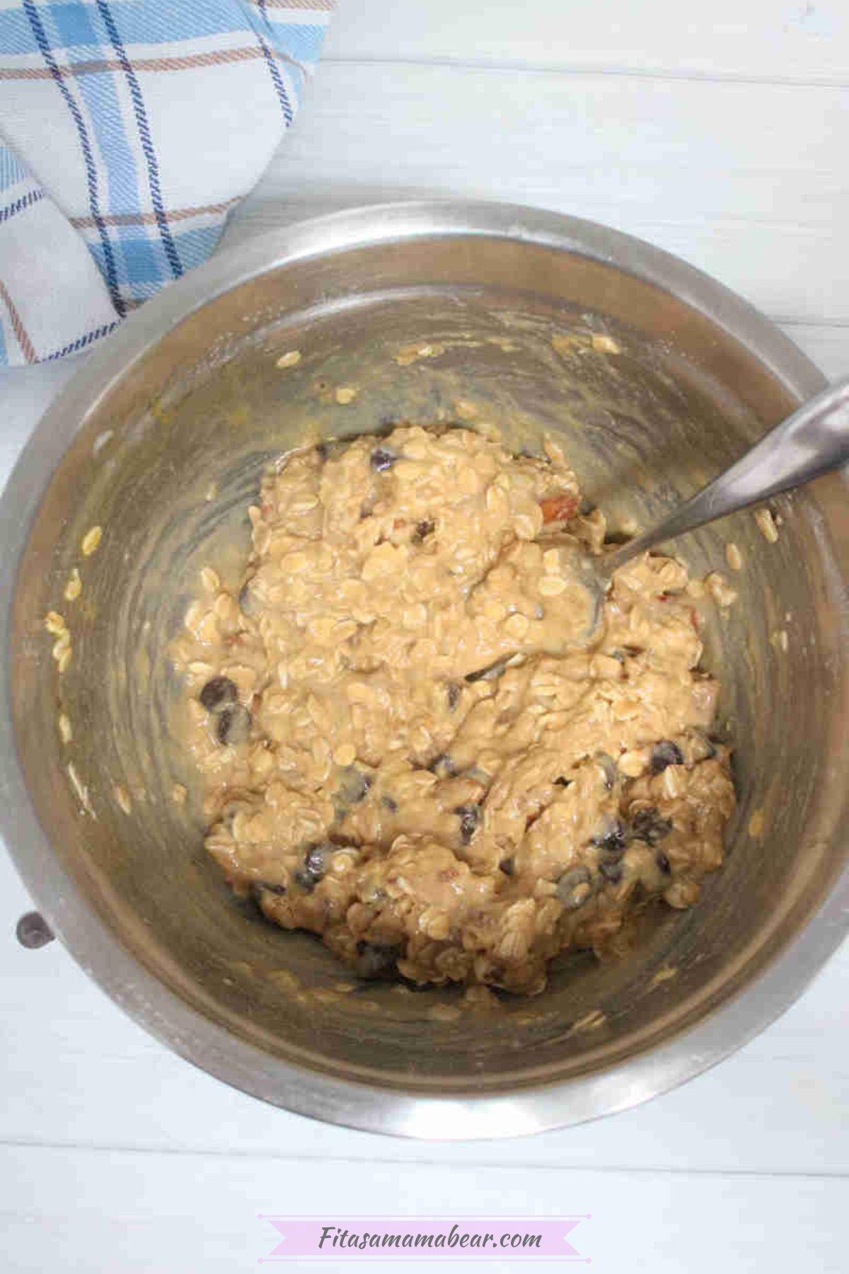 Mixing bowl with raw cookie dough in it.