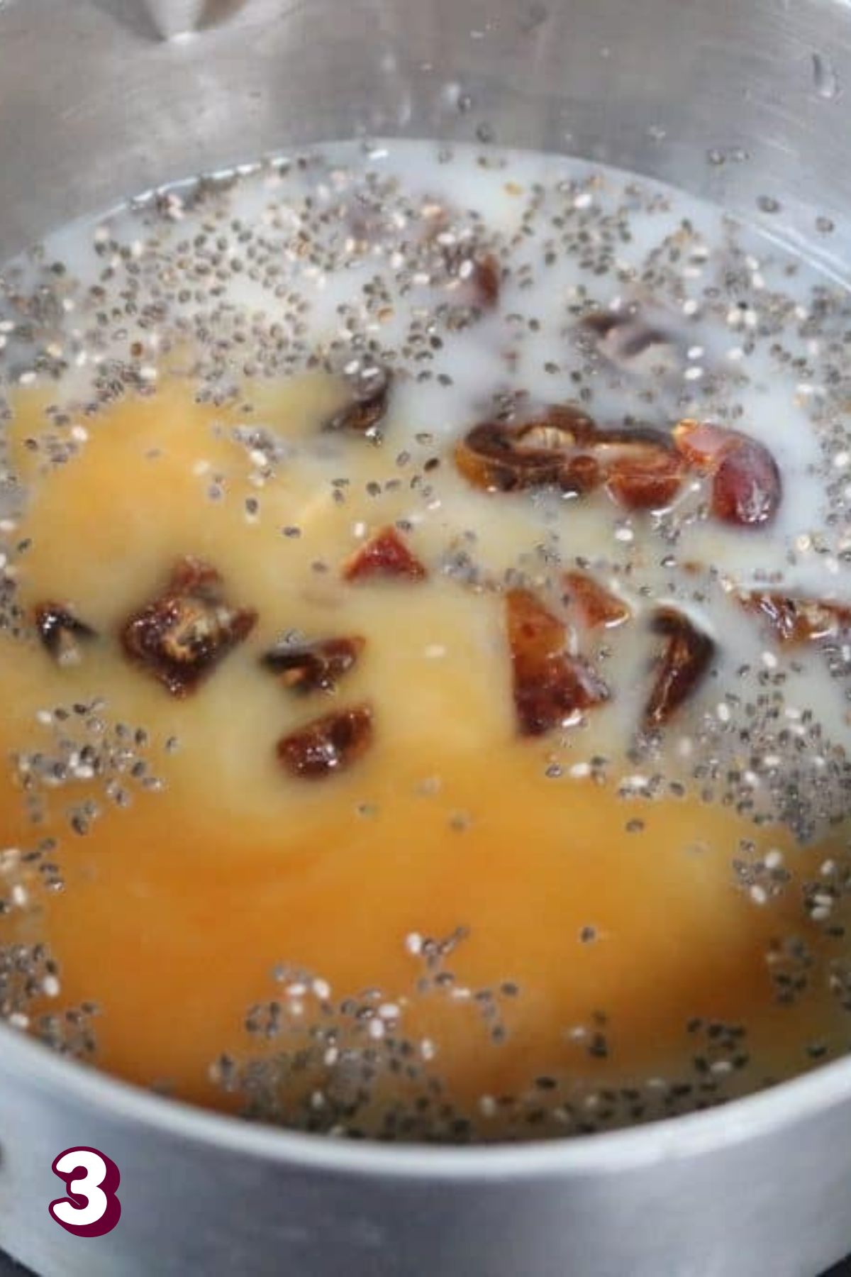 Maple pecan oatmeal with chia seeds, maple syrup, and pecans in a small pot.