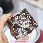 Featured image with text: no-bake peppermint patty bar being held in between two fingers close up