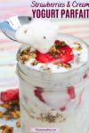Pinterest image with text: strawberry yogurt parfait in a mason jar topped with granola with a spoon coming out of the jar