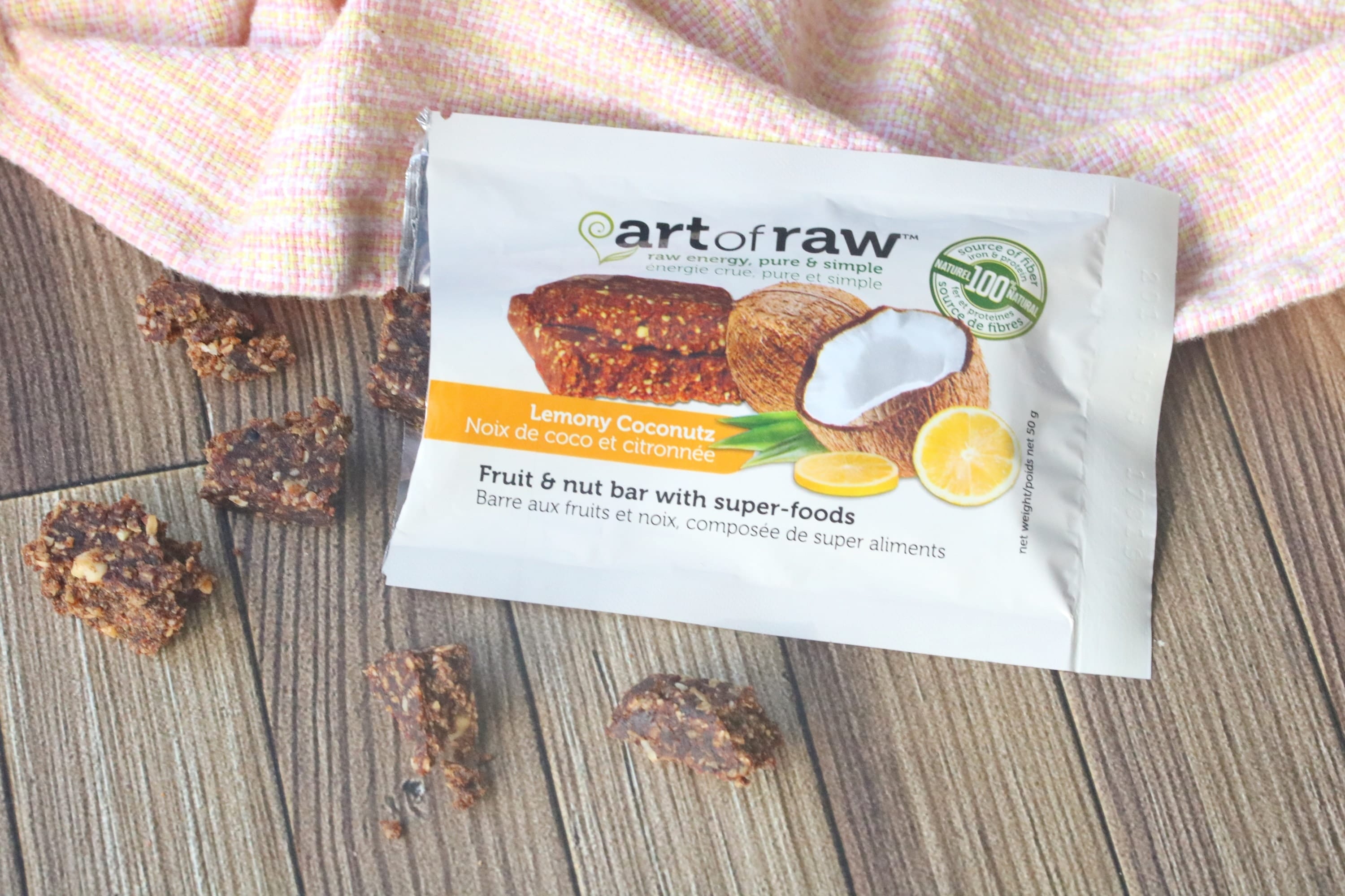Healthy store bought snack with pieces of bar around it