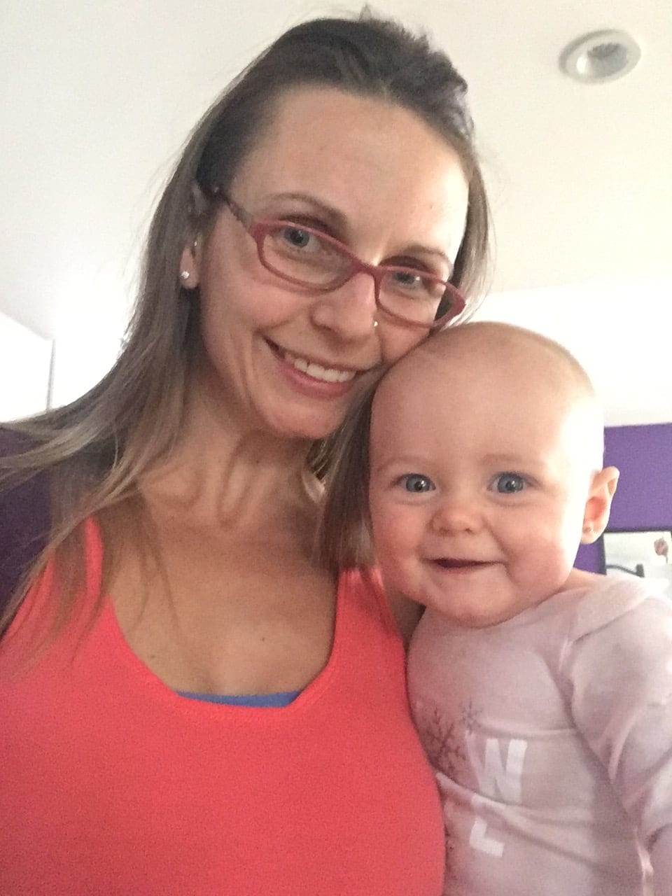 mom snuggling with baby