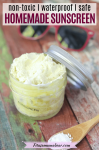 Pinterest image with text: mason jar with DIY sunscreen with zinc oxide on a wooden spoon beside it