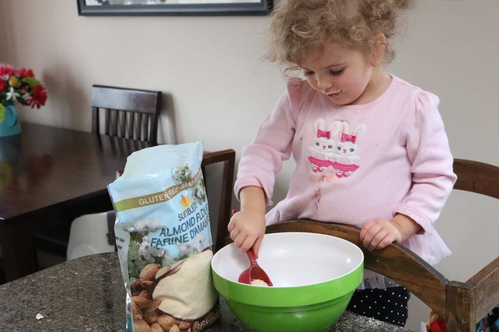 Toddler helping bake