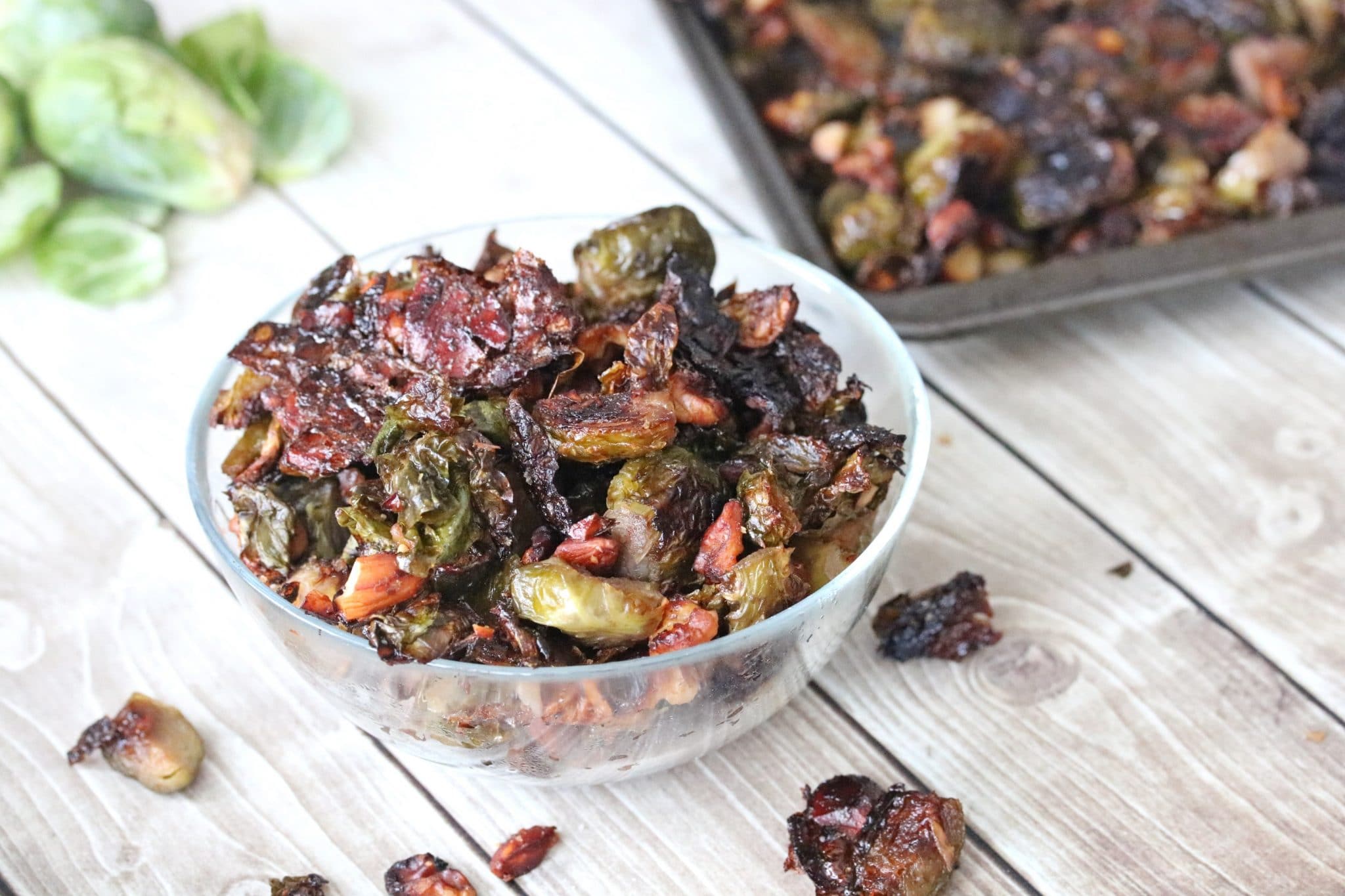 Candied Brussels sprouts in a glass dish.