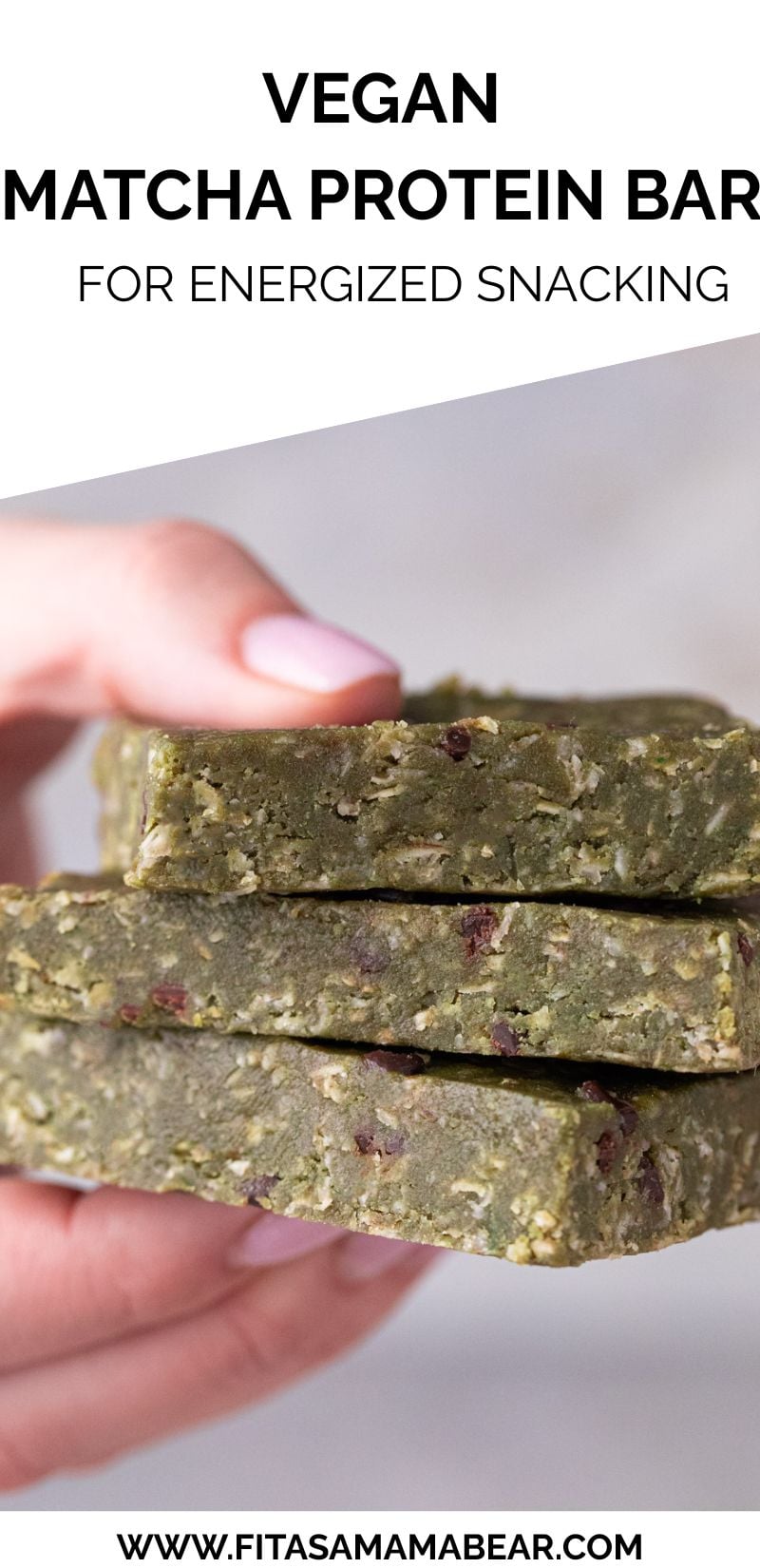 Three matcha protein bars stacked with fingers holding them.
