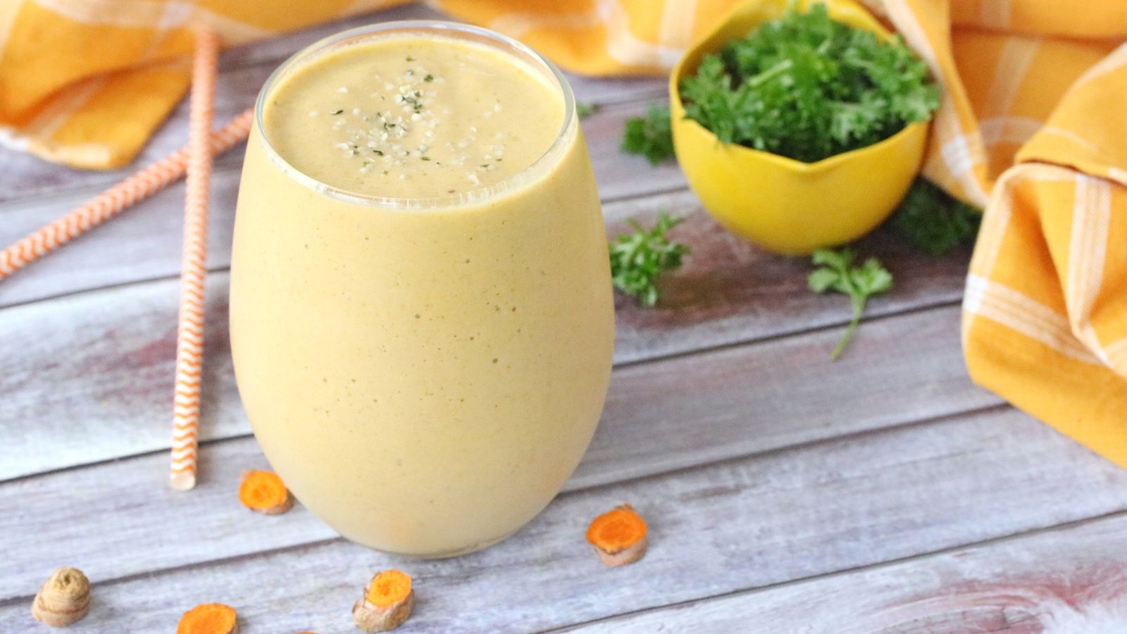 Featured image: Gourmet mango carrot turmeric smoothie in a clear glass