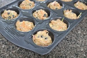 Gluten-free morning glory muffins in a muffin tin ready to be put in the oven