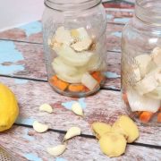 Immune system boost of fire cider with the ingredients in the jars