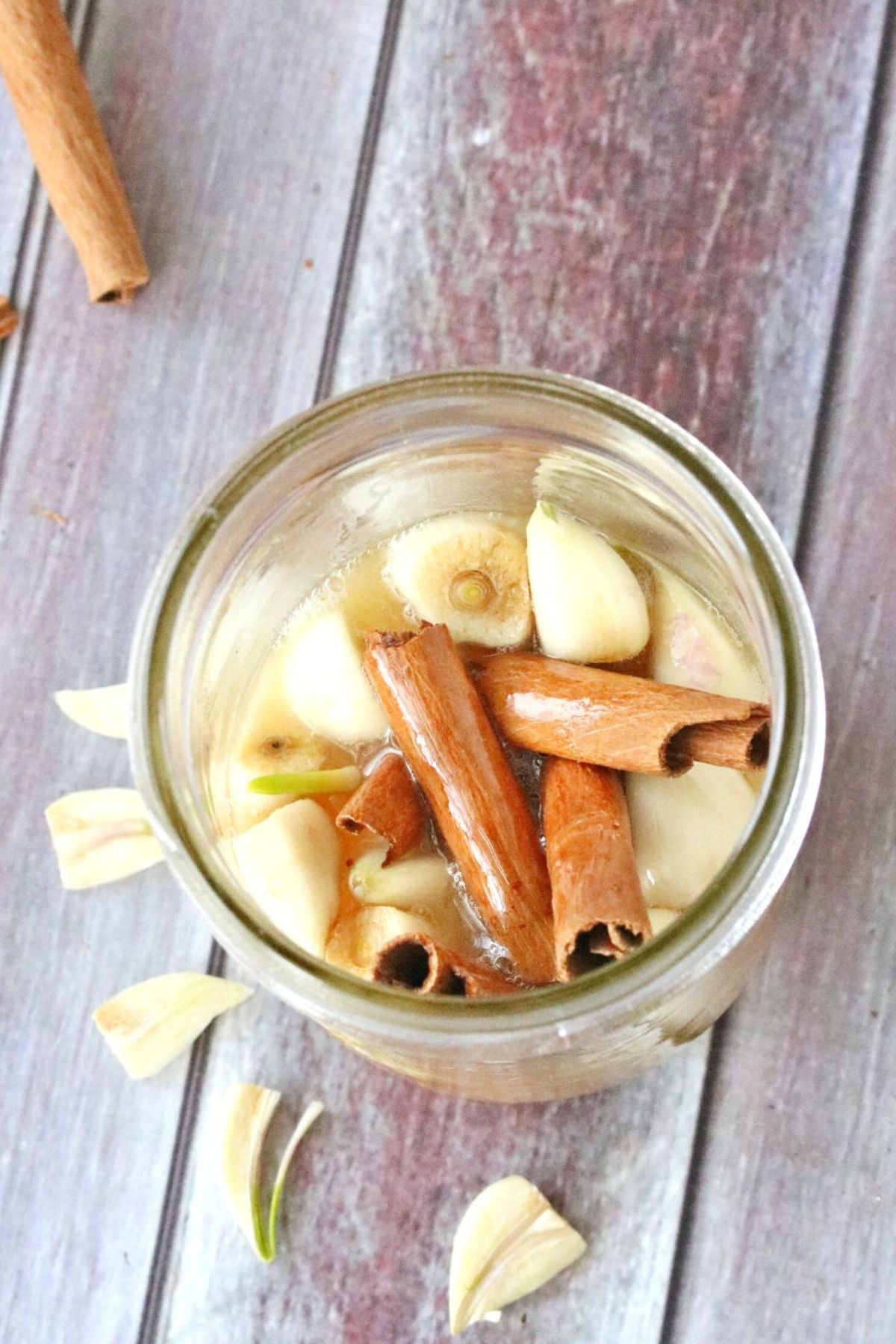Fermented garlic and honey wit cinnamon in a jar.