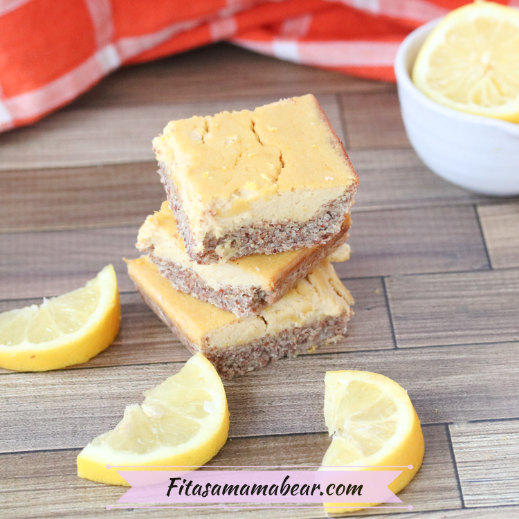 Featured image: three paleo lemon bars stacked with cut lemons around it and more behind them