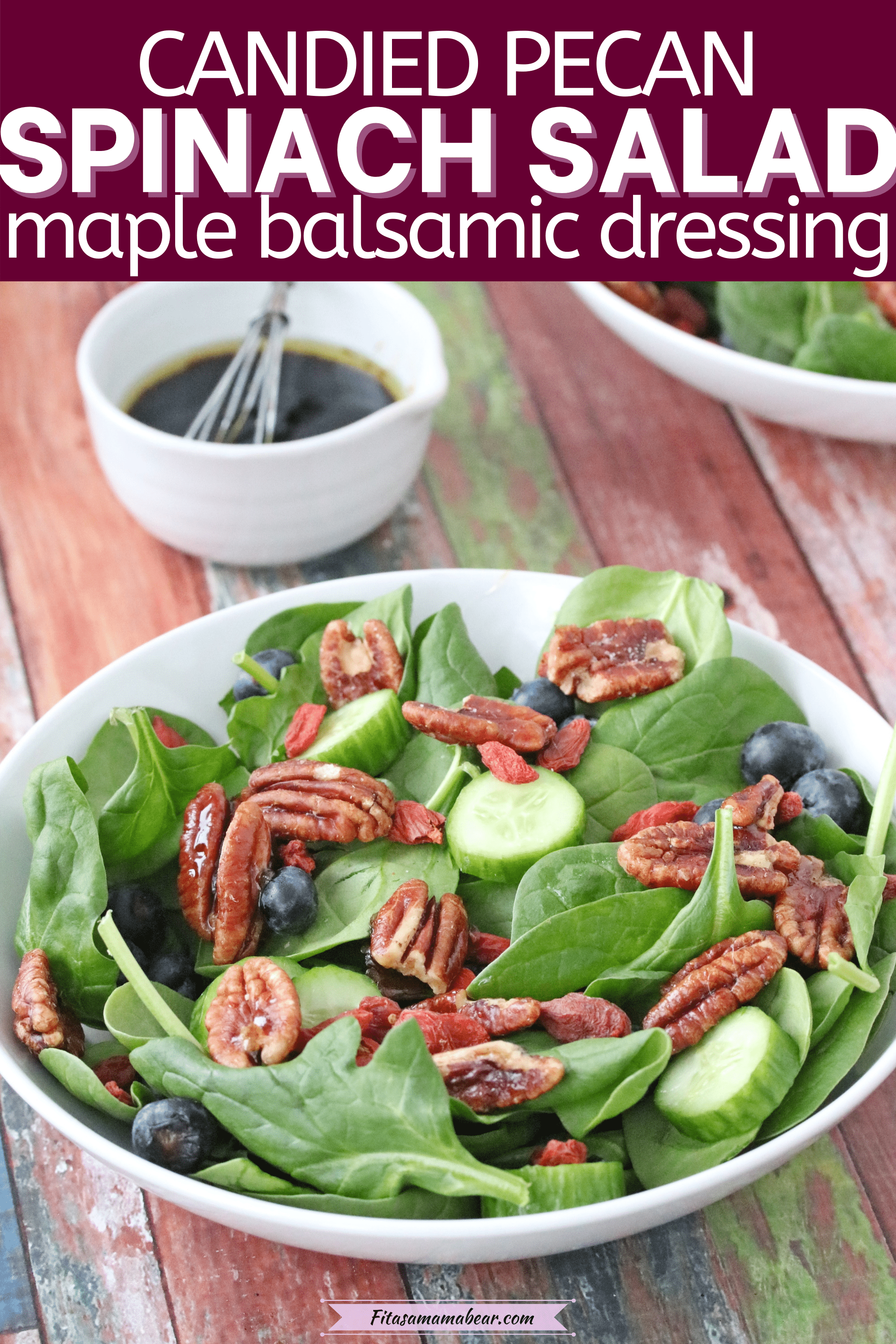 Pinterest image with text: Spinach salad with pecans in a white bowl with another bowl of salad behind it and pecans on the table
