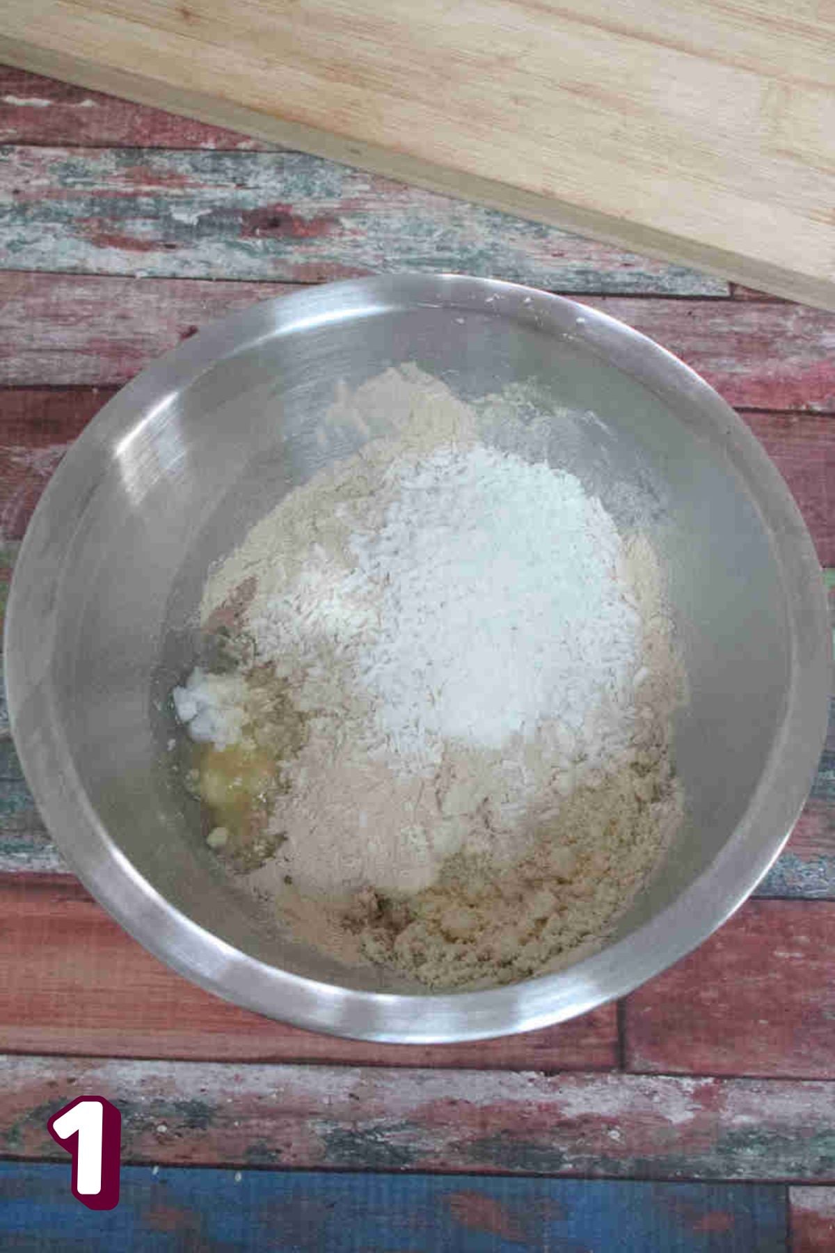 Almond flour and protein powder in a steel bowl.