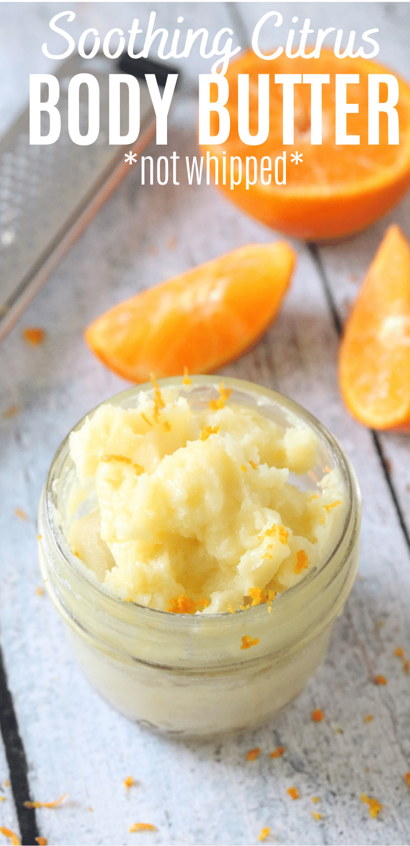 Pinterest image with text: homemade citrus body butter with coconut oil in a glass jar with orange zest on top and slices orange behind it and a zester beside it