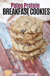Pinterest image with text: homemade protein cookies stacked in a pile with an orange linen behind them
