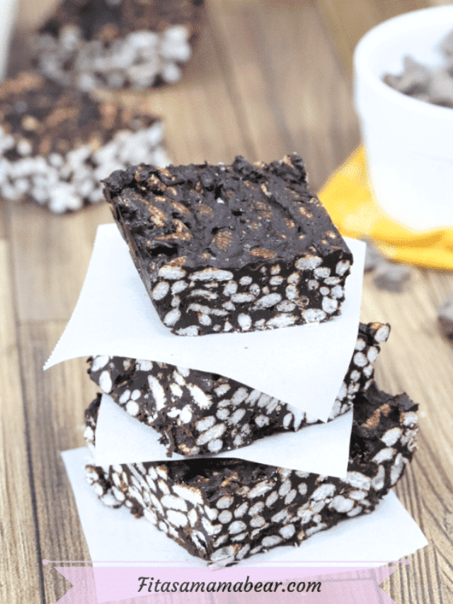 Featured image: three chocolate crunch bars stacked on parchment paper with more bars and a ramekin of chocolate chips behind it