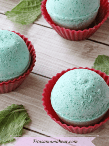 Featured image: three green bath bombs in red muffin cups with mint beside them