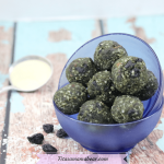 Featured image with text: superfood energy balls in two glass blue bowls stacked with collagen powder behind them and dried blueberries around them