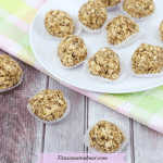 Featured image with text: banana energy balls in mini muffin tins, three balls in front of a plate on a colored napkin with more balls