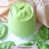Featured image with text: mango green smoothie in a tumbler glass with spinach leaves around it and an orange linen behind it