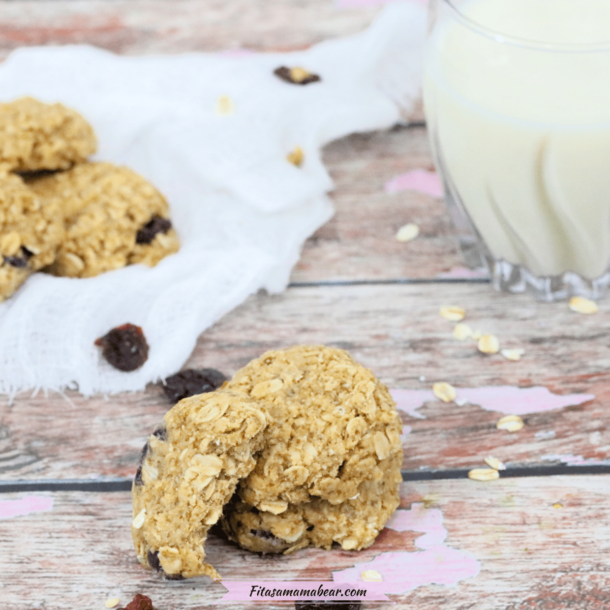 Featured image: no-bake lactation cookies stacked with one on the side and more cookies and milk behind them