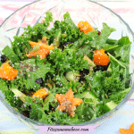 Featured image: vegan kale salad in a glass bowl with orange peppers