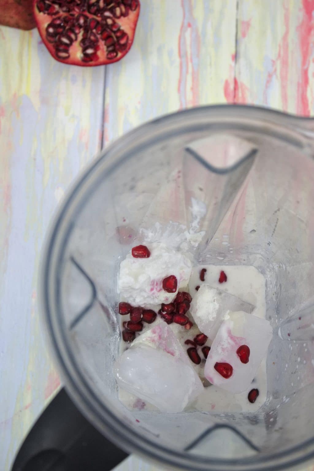Blender with ice, pomegranate arils and collagen powder