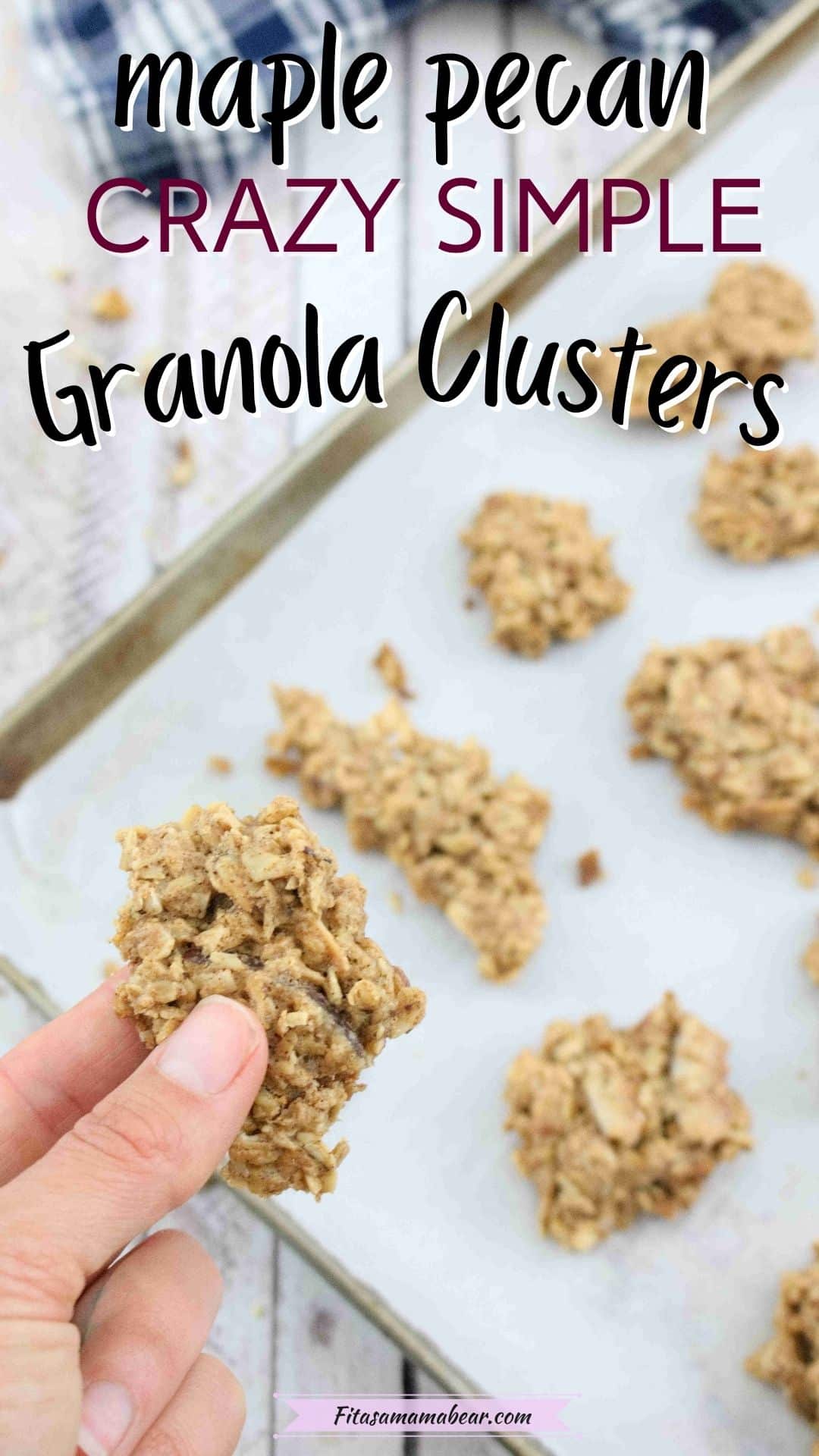 Pin image with text: Baking sheet lined with parchment paper with granola clusters on it and a hand holding on cluster close up
