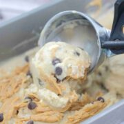 Close up of an ice cream scoop scooping peanut butter chocolate chip ice cream