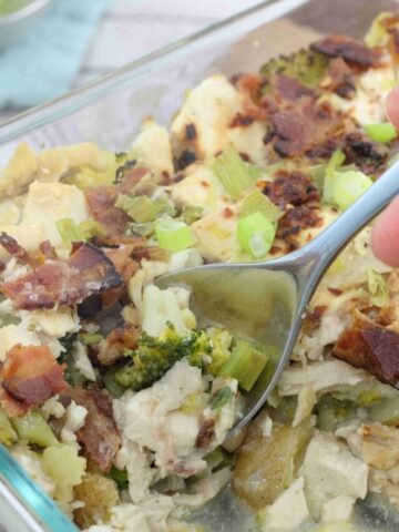 Pin image with text about chicken and potato casserole with an image of a casserole with bacon and broccoli with a spoon scooping some out