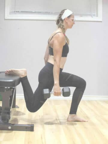 Woman in sports bran and tights with back foot elevated on bench and holding dumbbells with text about a workout split overhead