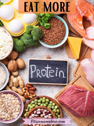 Multiple protein-rich foods like meat, cheese, nuts, and seeds around a chalkboard with the word protein on it.