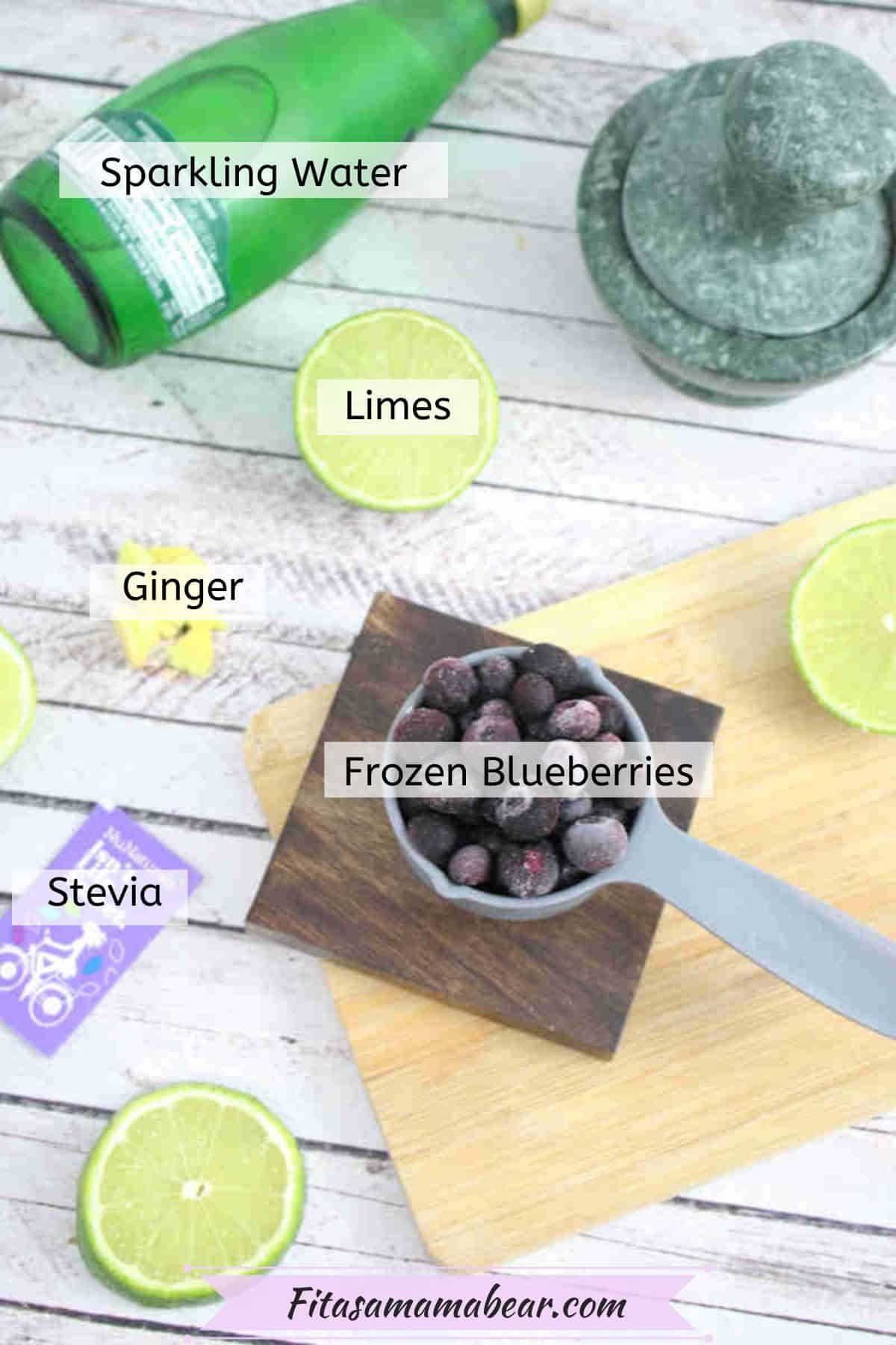 Ingredients to make a blueberry mocktail in measuring cups with text labels on it.