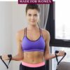 Woman in purple sports bra and shorts performing a band curl at home with text on the eimage.