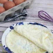 Egg white wraps on a blue flowered plate.