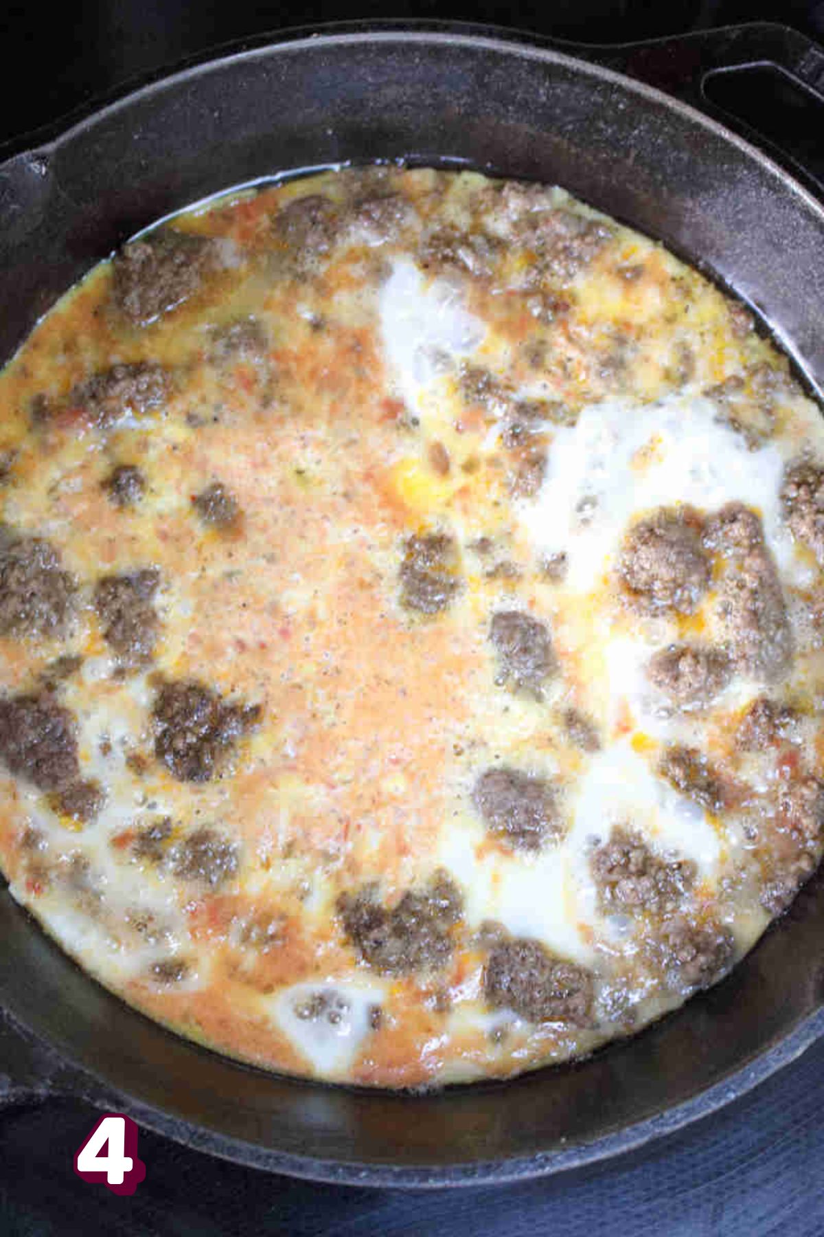 Cooked ground beef in a cast-iron skillet.