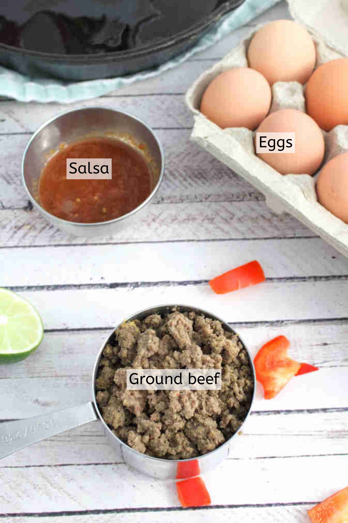 Ground beef, salsa, eggs, and peppers all with text labels over the ingredients.