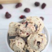 Protein balls with cranberries in a white bowl.