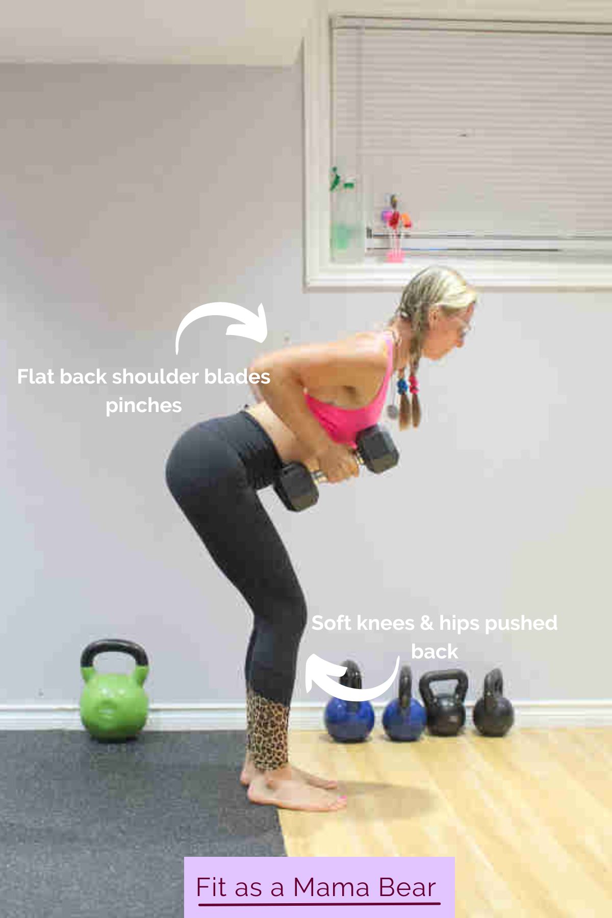 Woman in sports bra and black pants performing a bentover row with two dumbbells.