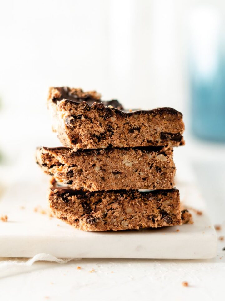 Three cookie dough bars stacked on one another.