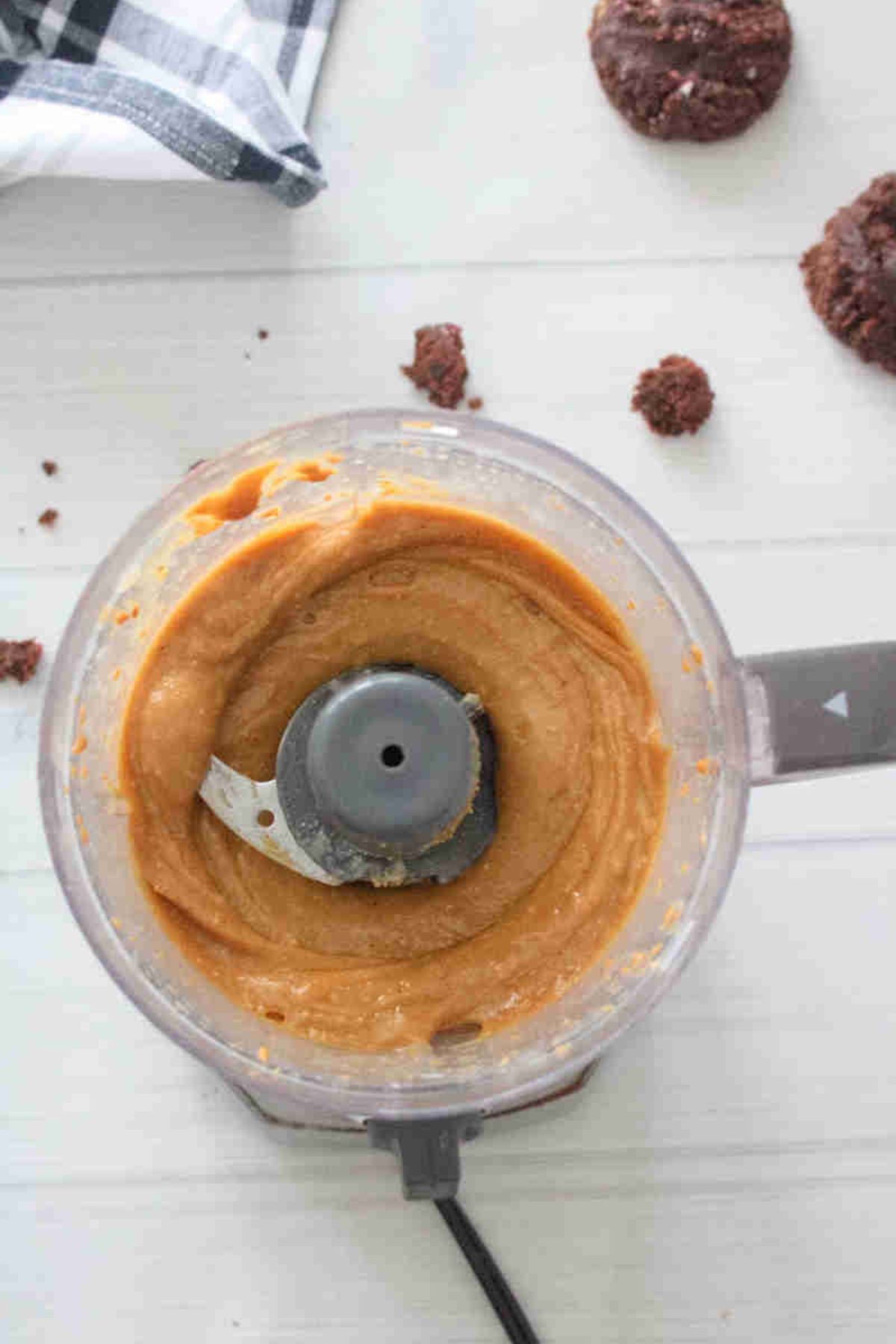 Mini food processor with protein cookie butter in it.