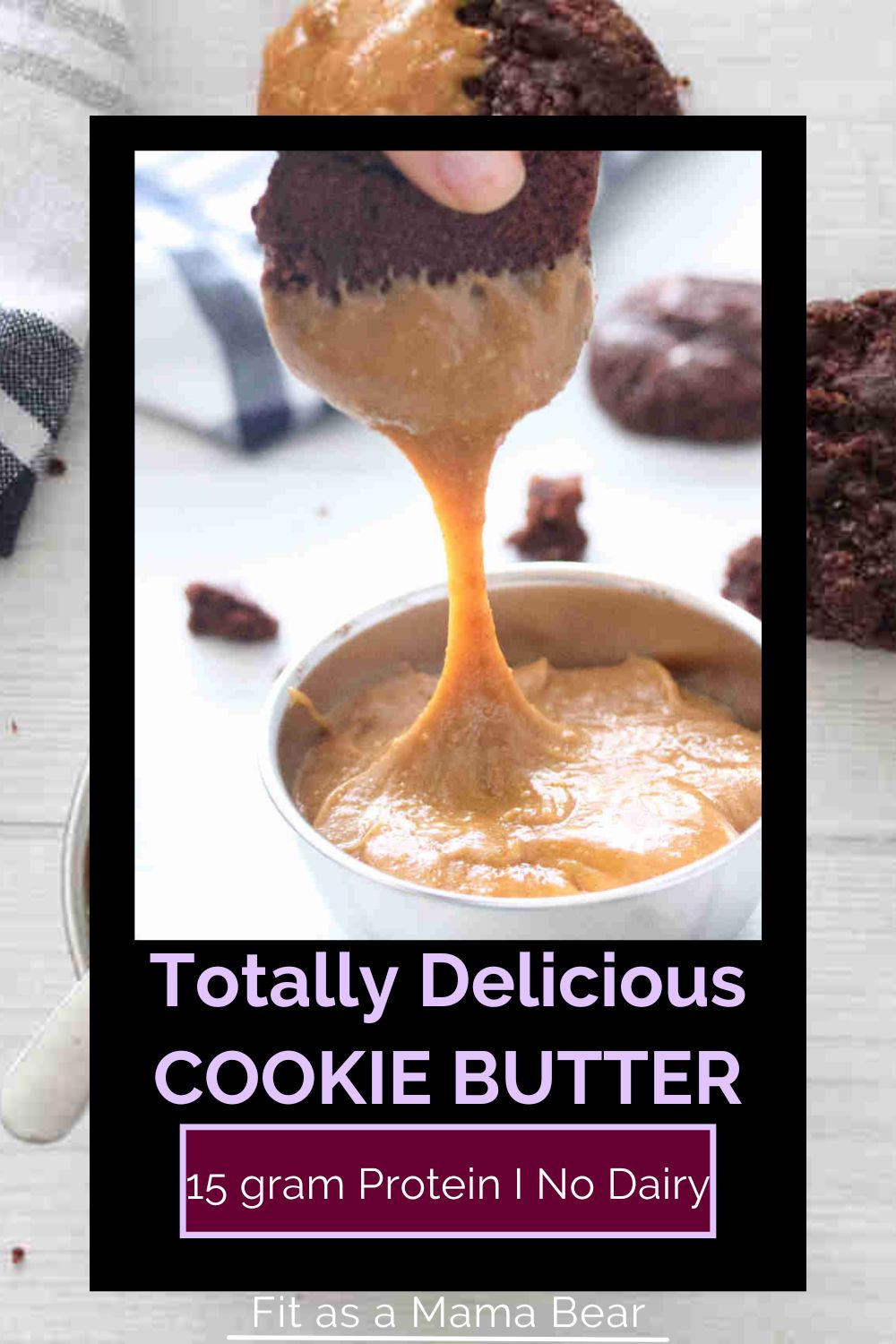 Chocolate cookie being dipped into a bowl of homemade protein cookie butter with text on the image.